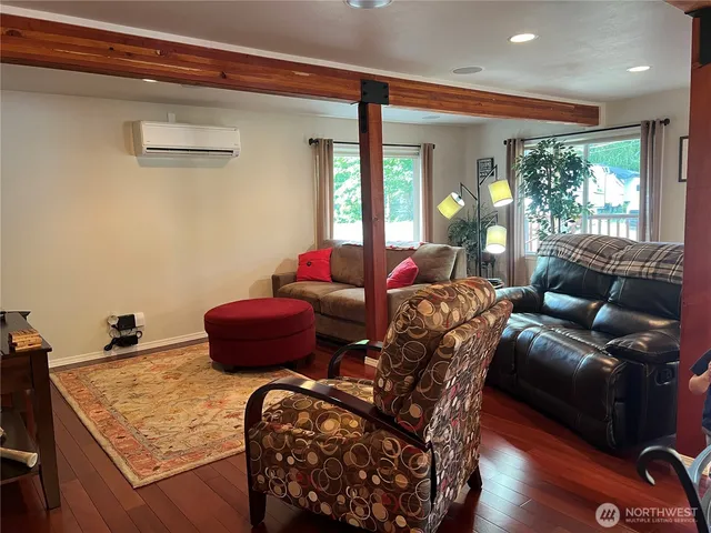a living room with furniture and a window