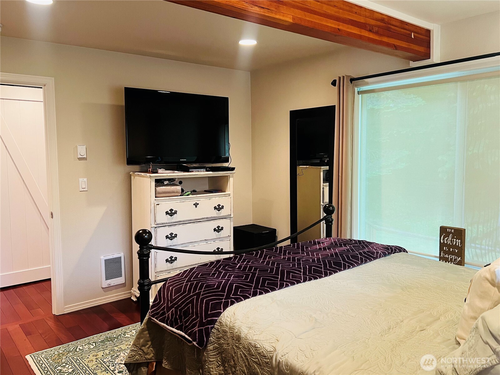 601 Mountain Trail Road Brinnon, WA 98320 - Photo 16 of 30 a bedroom with a bed and a flat screen tv