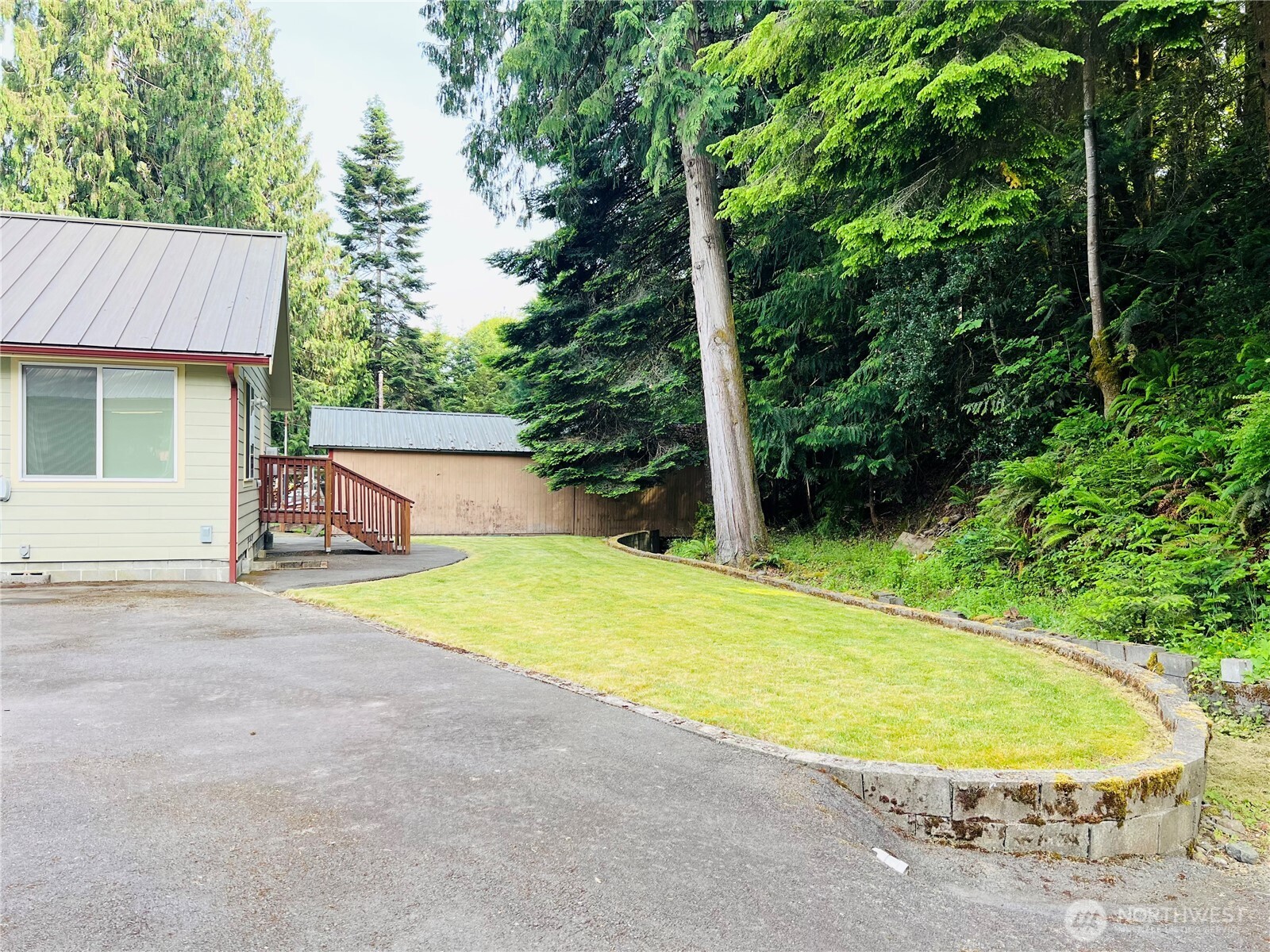 601 Mountain Trail Road Brinnon, WA 98320 - Photo 24 of 30 an outdoor space with pool and trees