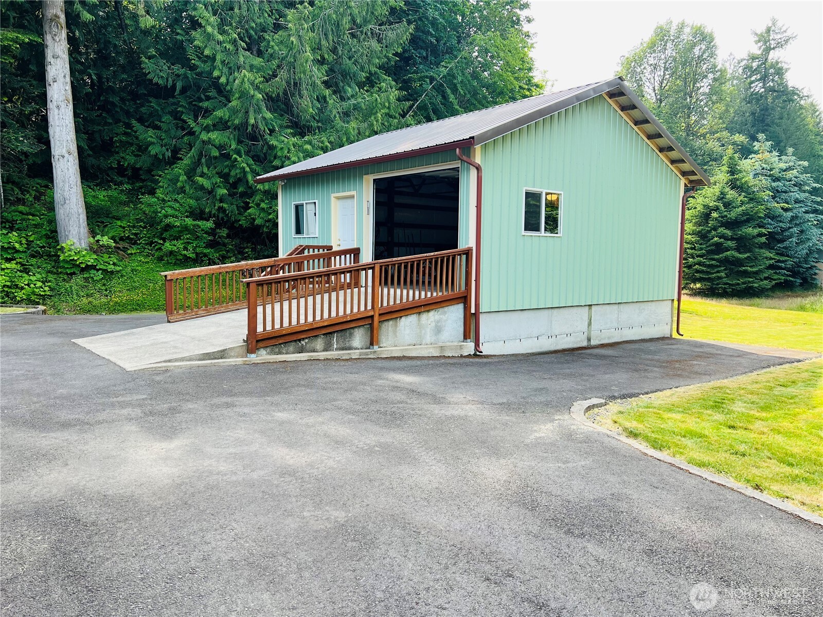 601 Mountain Trail Road Brinnon, WA 98320 - Photo 25 of 30 a view of a house with backyard and garden