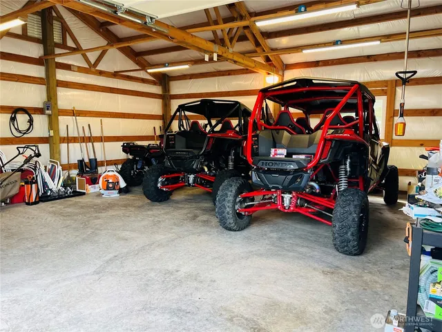 a view of parking garage with cars
