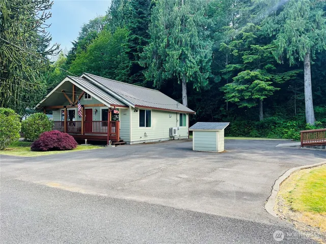 a house with trees in the background