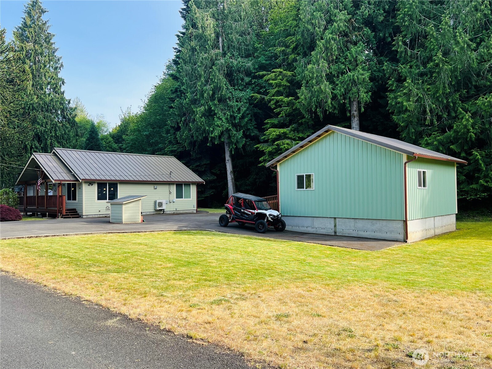 601 Mountain Trail Road Brinnon, WA 98320 - Photo 29 of 30 a house that has a swimming pool in front of it