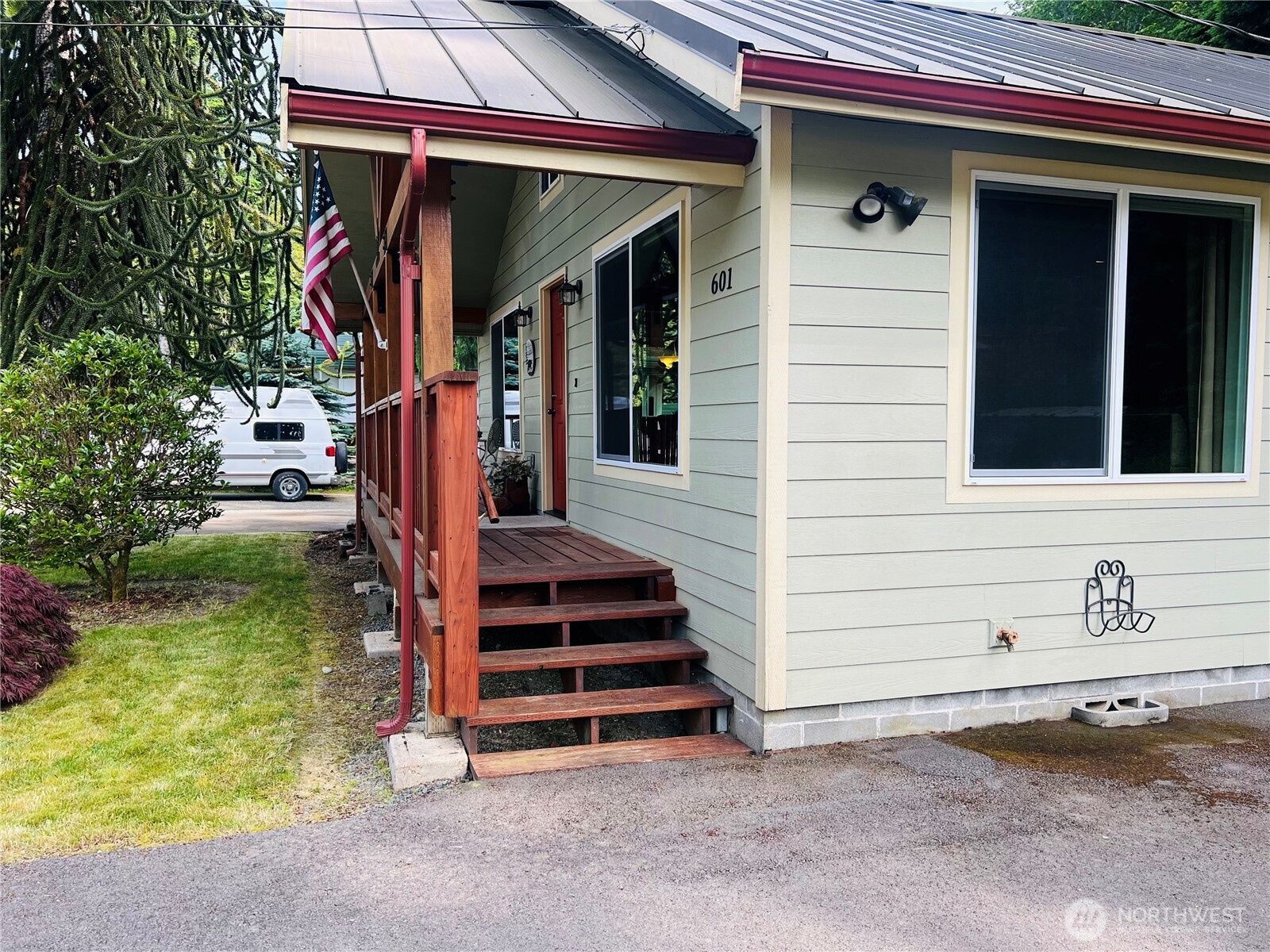 601 Mountain Trail Road Brinnon, WA 98320 - Photo 4 of 30 a view of a house with a yard and stairs