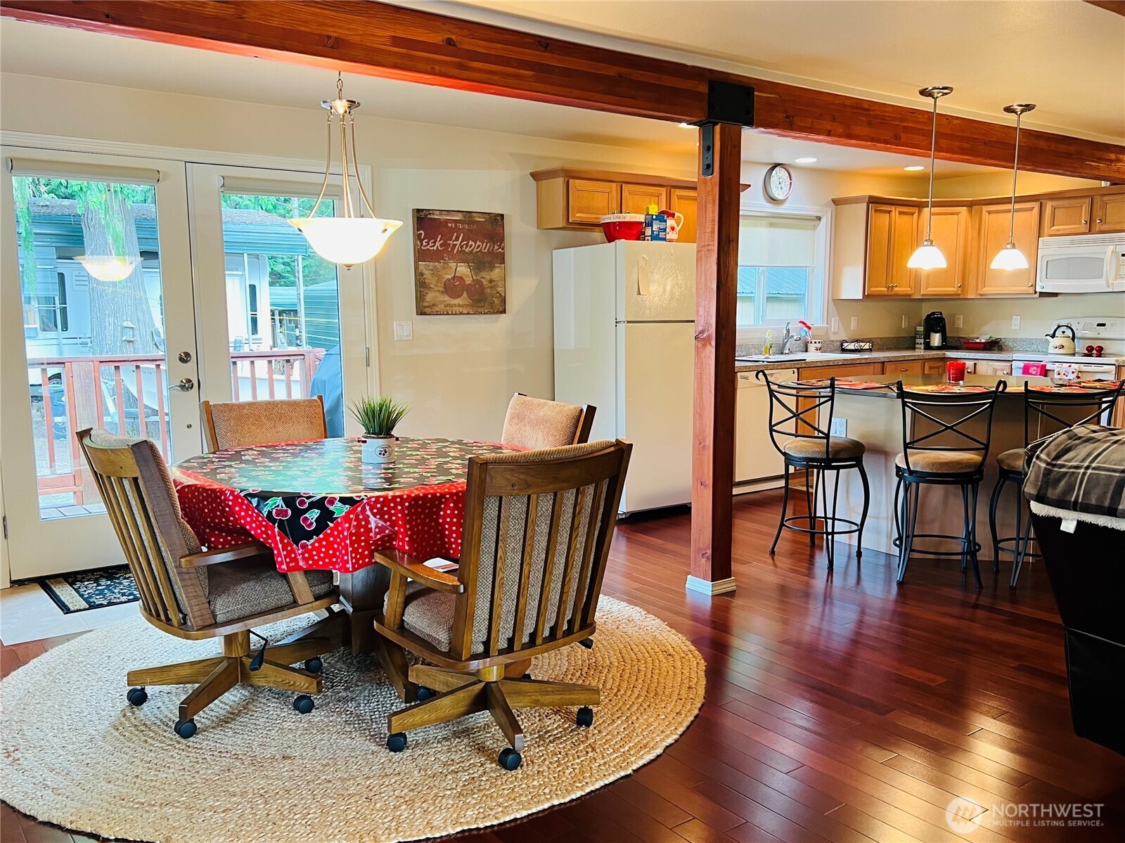 601 Mountain Trail Road Brinnon, WA 98320 - Photo 6 of 30 a view of a dining room with furniture window and wooden floor
