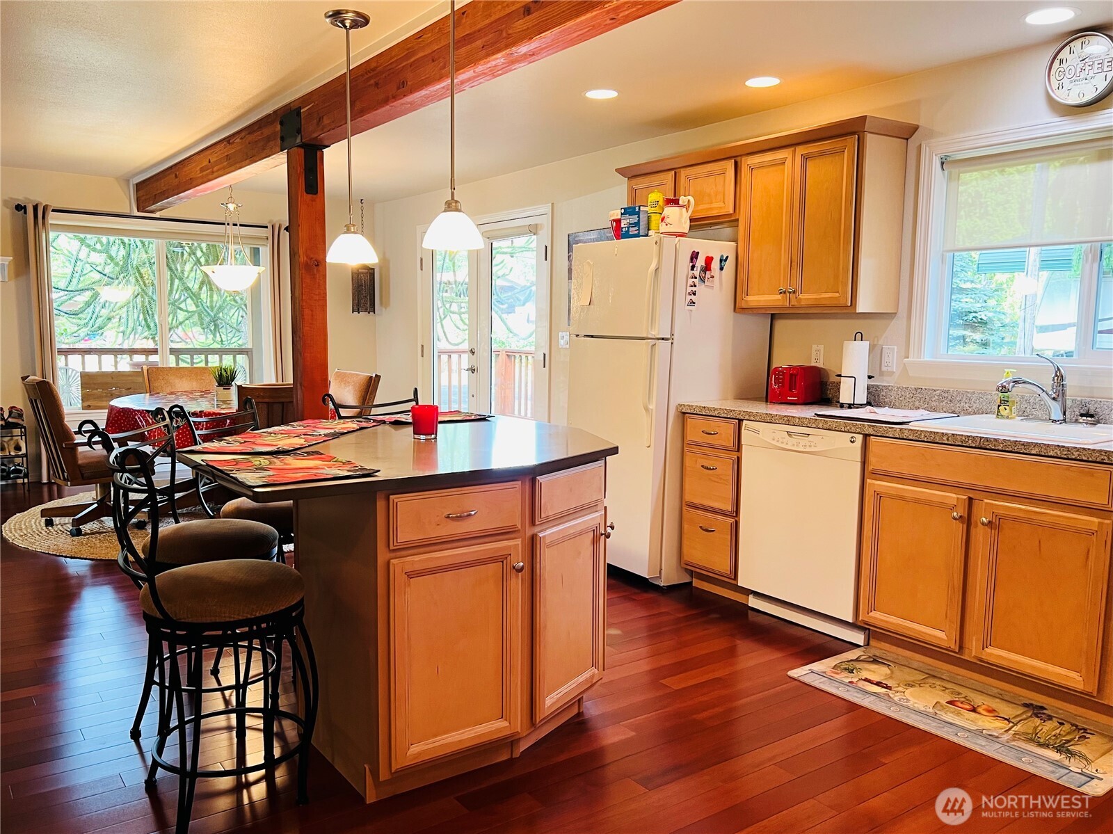 601 Mountain Trail Road Brinnon, WA 98320 - Photo 10 of 30 a kitchen with stainless steel appliances granite countertop a stove a sink dishwasher and a refrigerator with wooden floor
