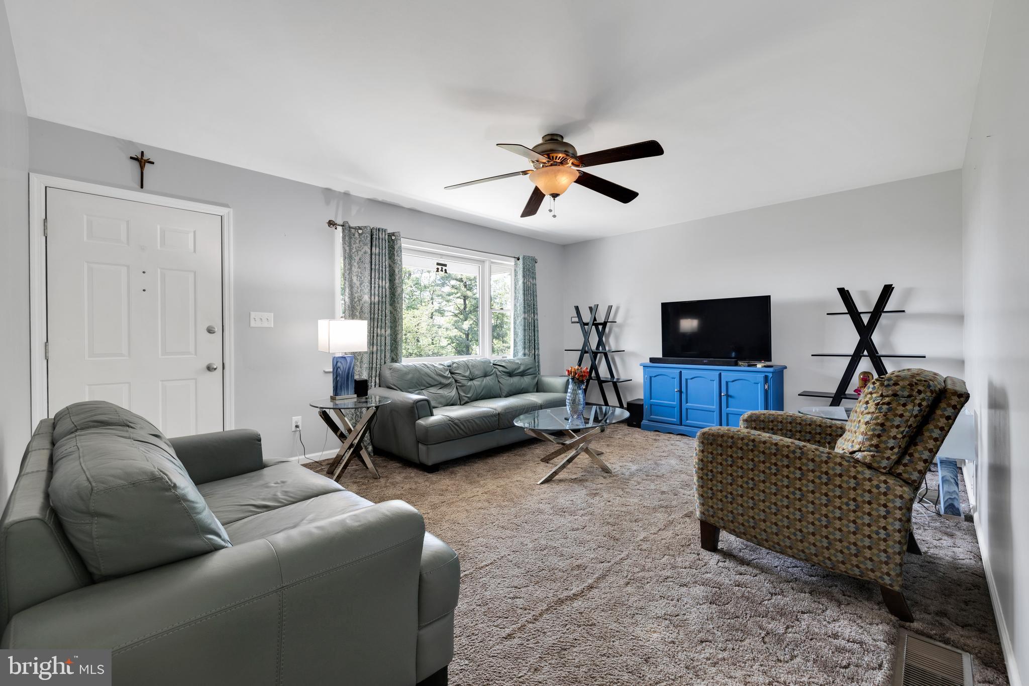 97 Bertolet Mill Road Oley, PA 19547 - Photo 6 of 35 a living room with furniture and a flat screen tv
