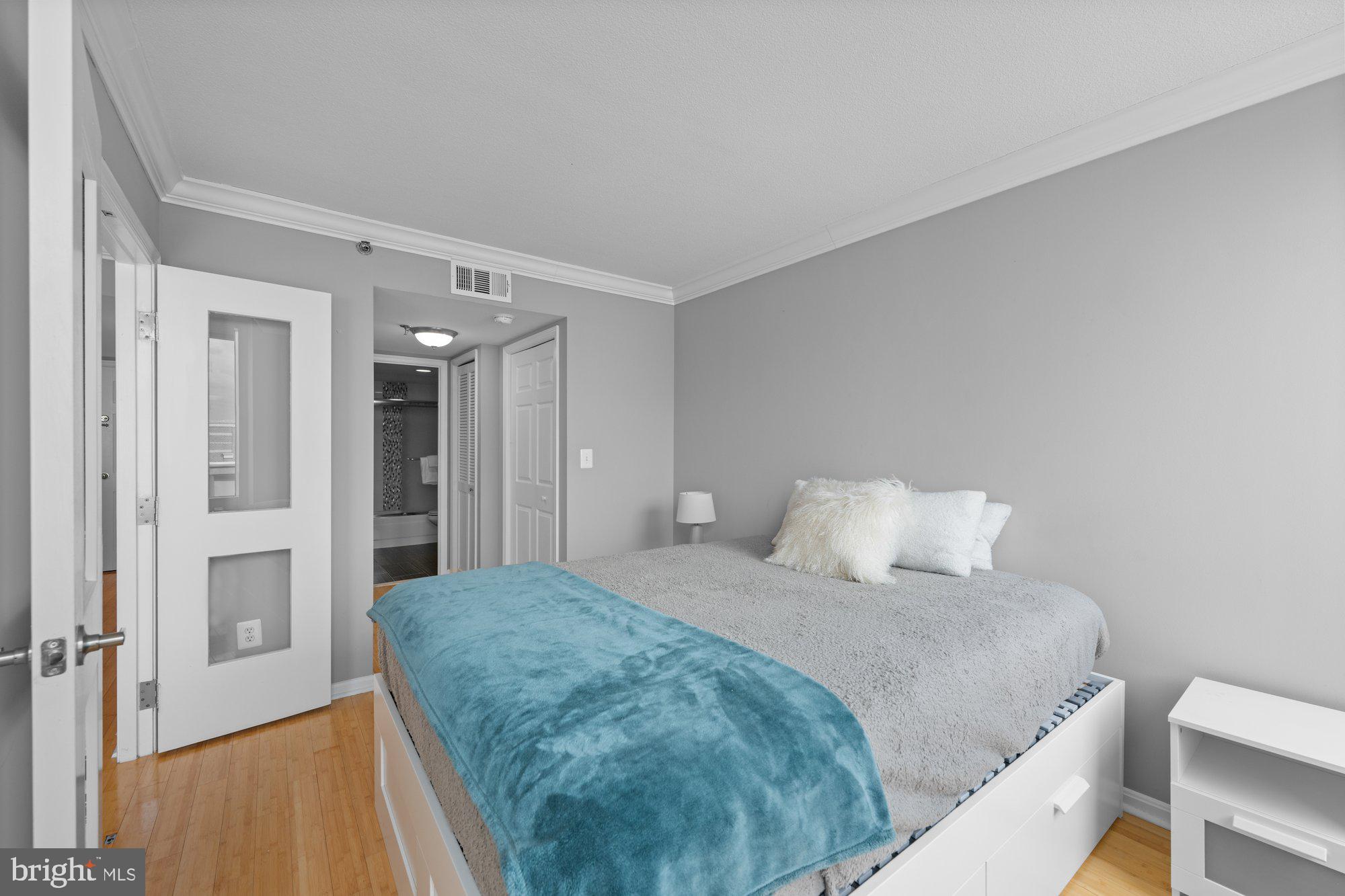 701 Pennsylvania Avenue Northwest, Unit PH2 Washington, DC 20004 - Photo 11 of 19 a bedroom with a bed and a table