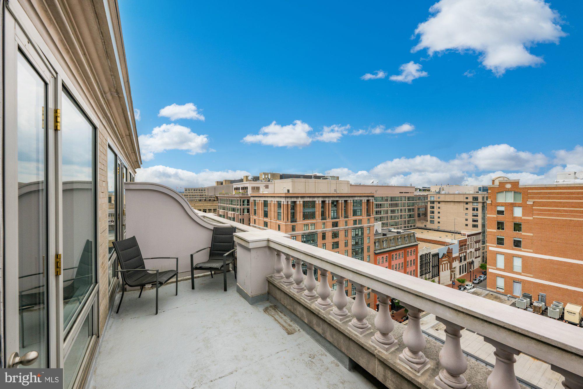 701 Pennsylvania Avenue Northwest, Unit PH2 Washington, DC 20004 - Photo 15 of 19 a view of a balcony with chairs