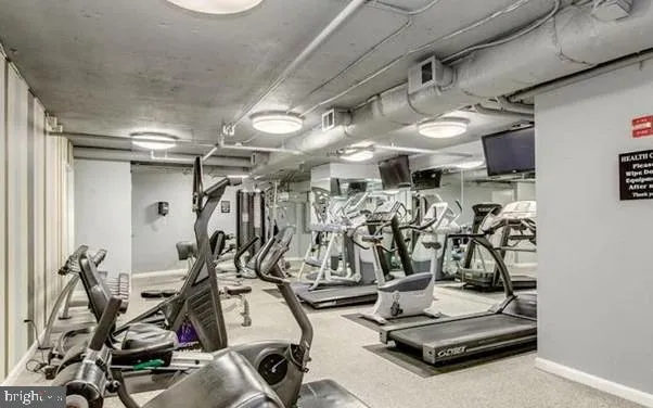 a view of a swimming pool with seating space