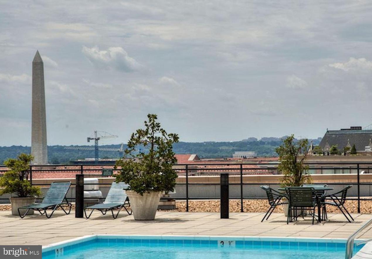701 Pennsylvania Avenue Northwest, Unit PH2 Washington, DC 20004 - Photo 17 of 19 a view of a swimming pool with seating space