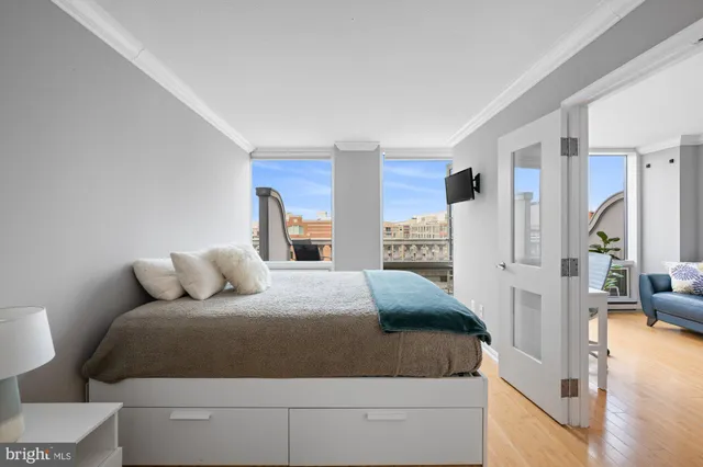 a bedroom with a bed and a table