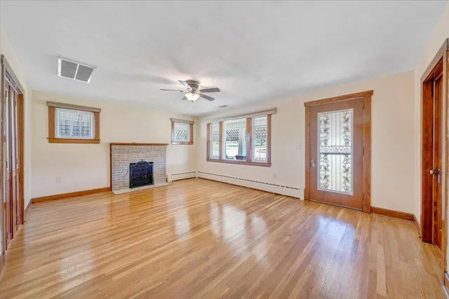 a bathroom with a sink toilet and window
