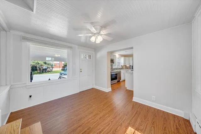 a front view of house with yard and outdoor seating