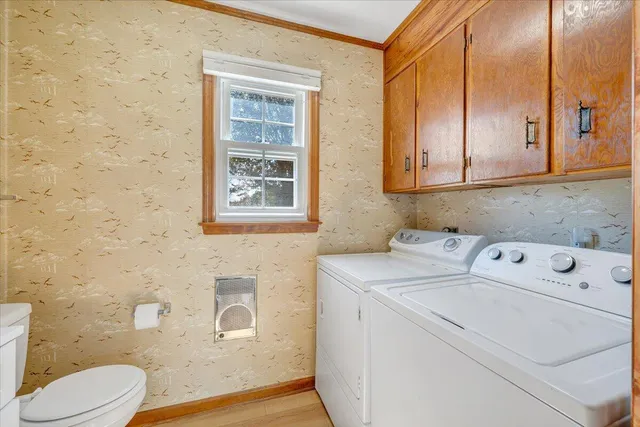 a view of a brick building next to a yard