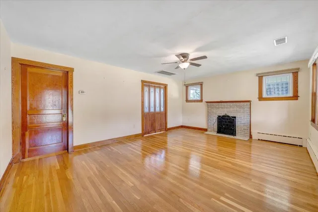 a kitchen with a sink cabinets stainless steel appliances and a window