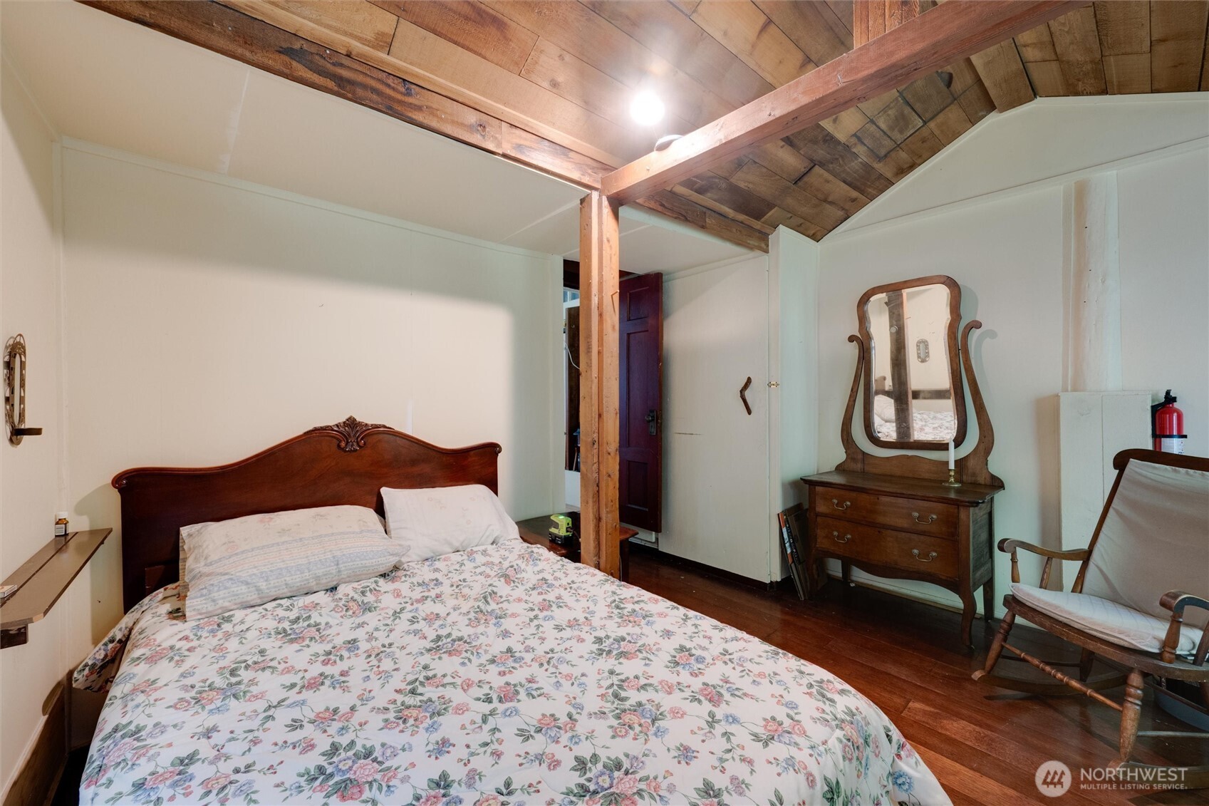 4315 Nordum Road Everson, WA 98247 - Photo 26 of 40 a bedroom with a bed and a chandelier