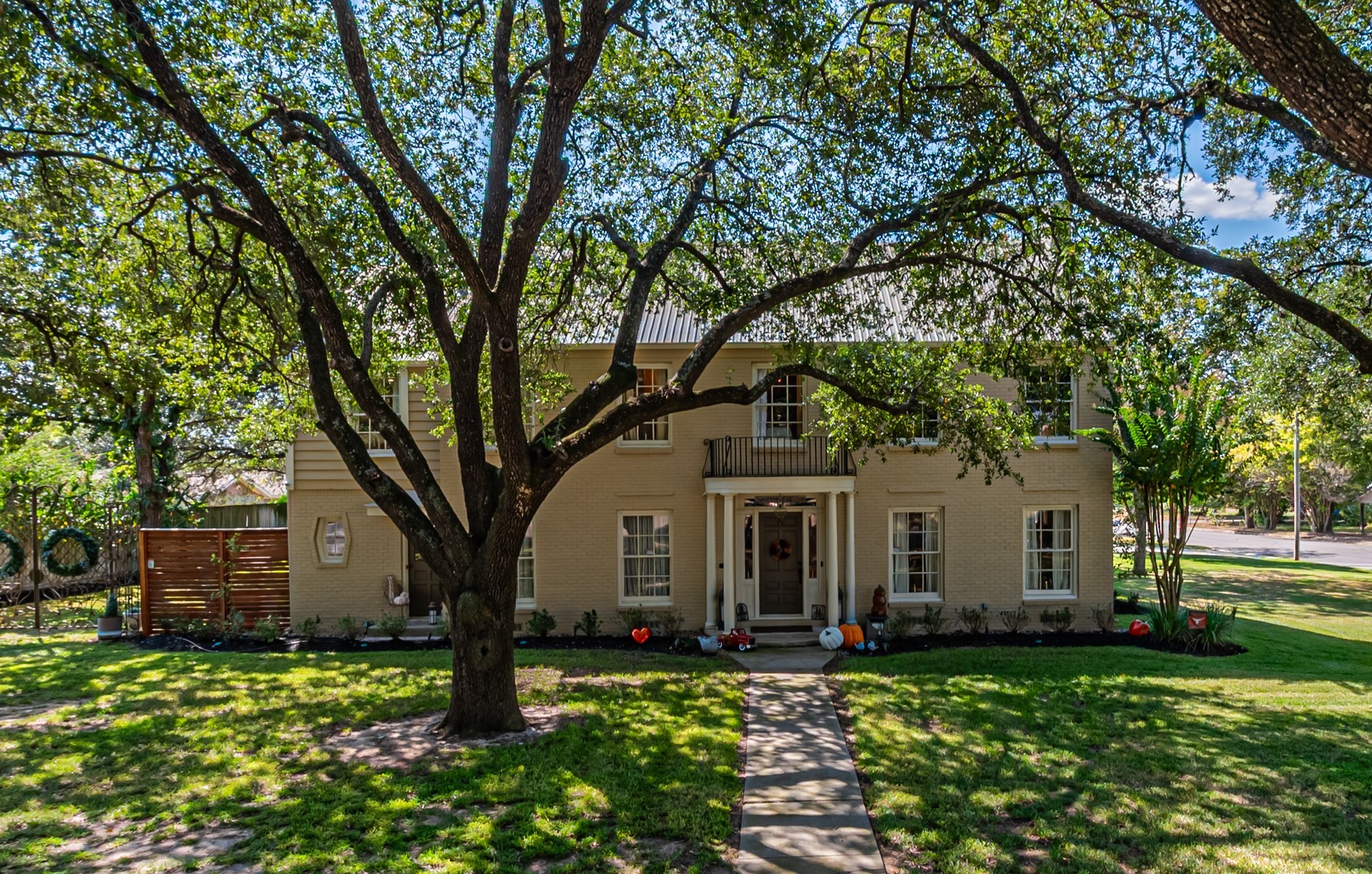 a front view of a house with garden