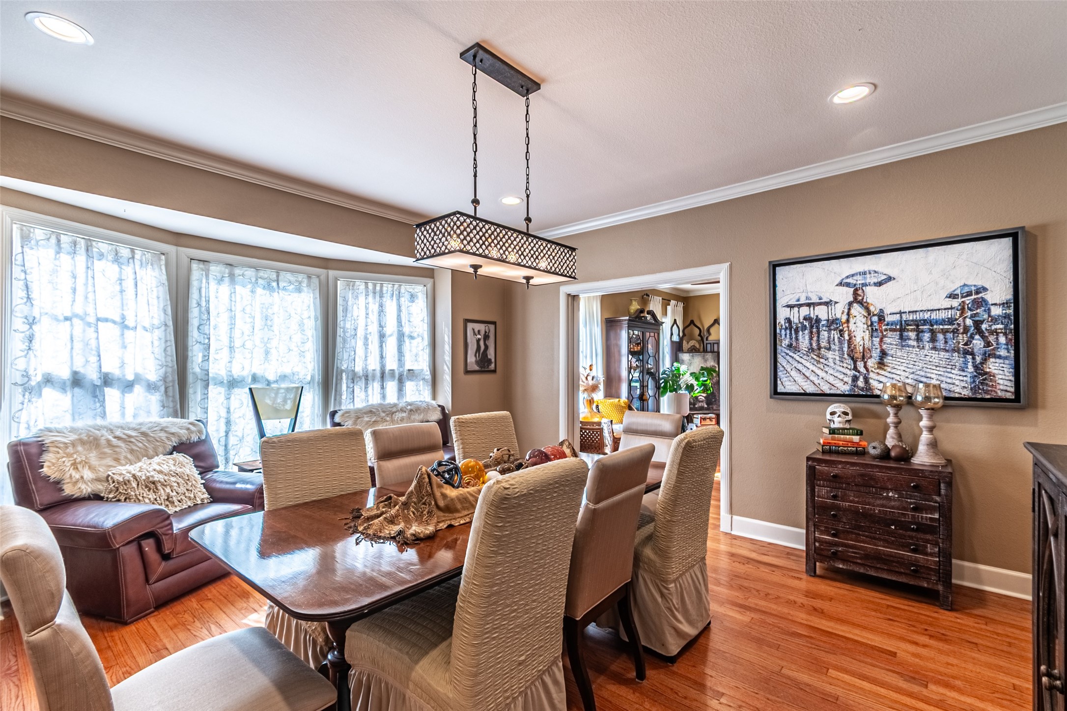 706 Church Street Navasota, TX 77868 - Photo 14 of 50 a dining room with furniture a chandelier and wooden floor