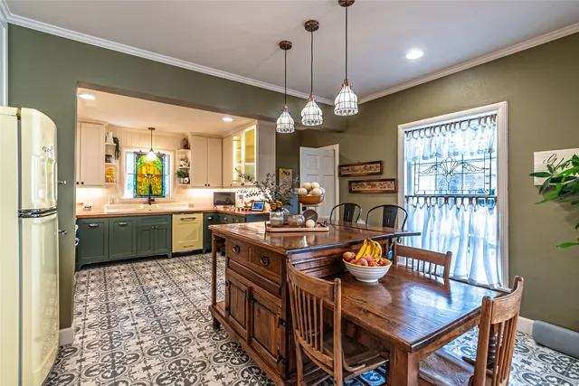 a kitchen with granite countertop a sink cabinets and window