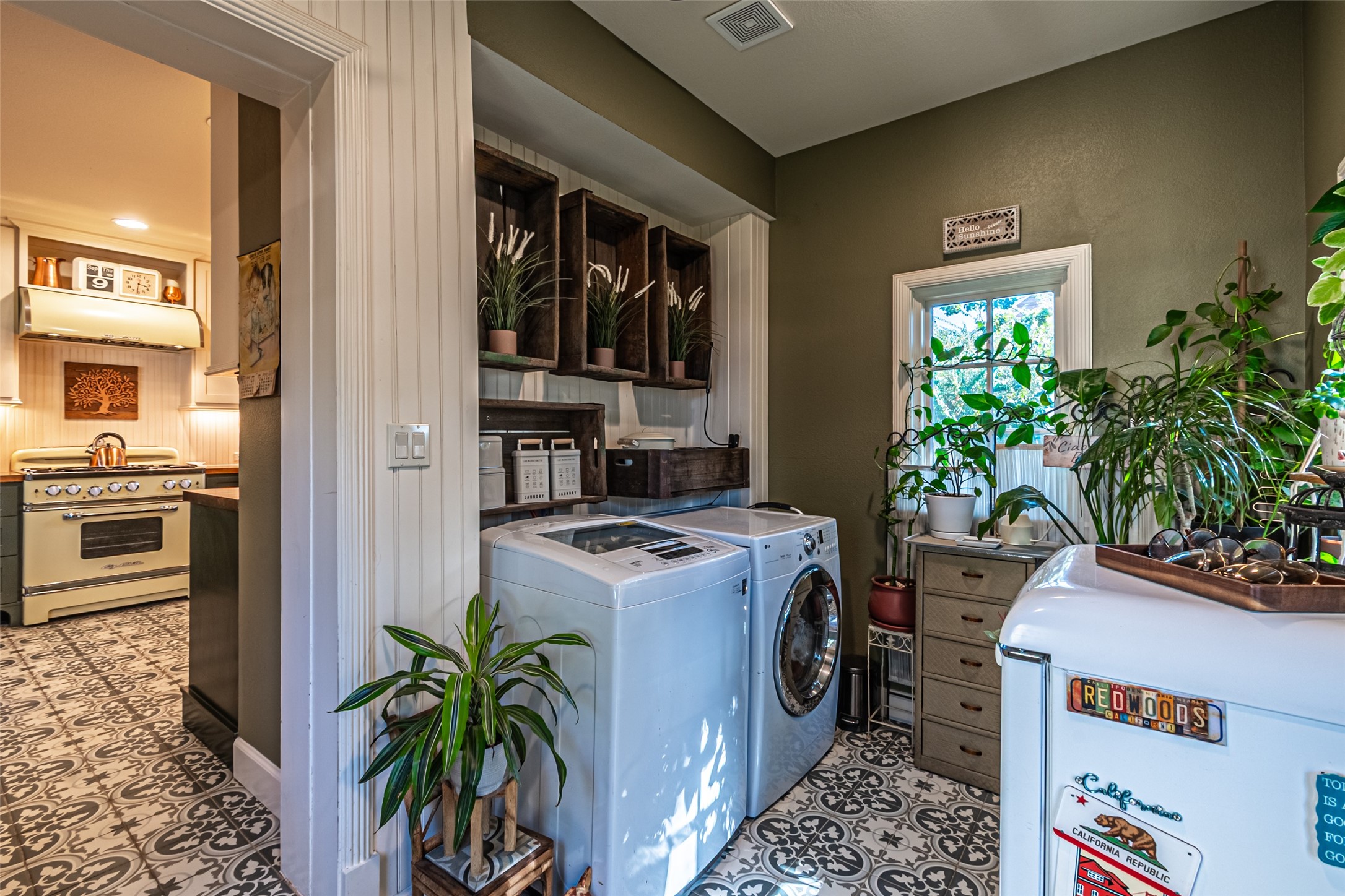 706 Church Street Navasota, TX 77868 - Photo 22 of 50 a view of a kitchen with a stove top oven a sink and potted plants
