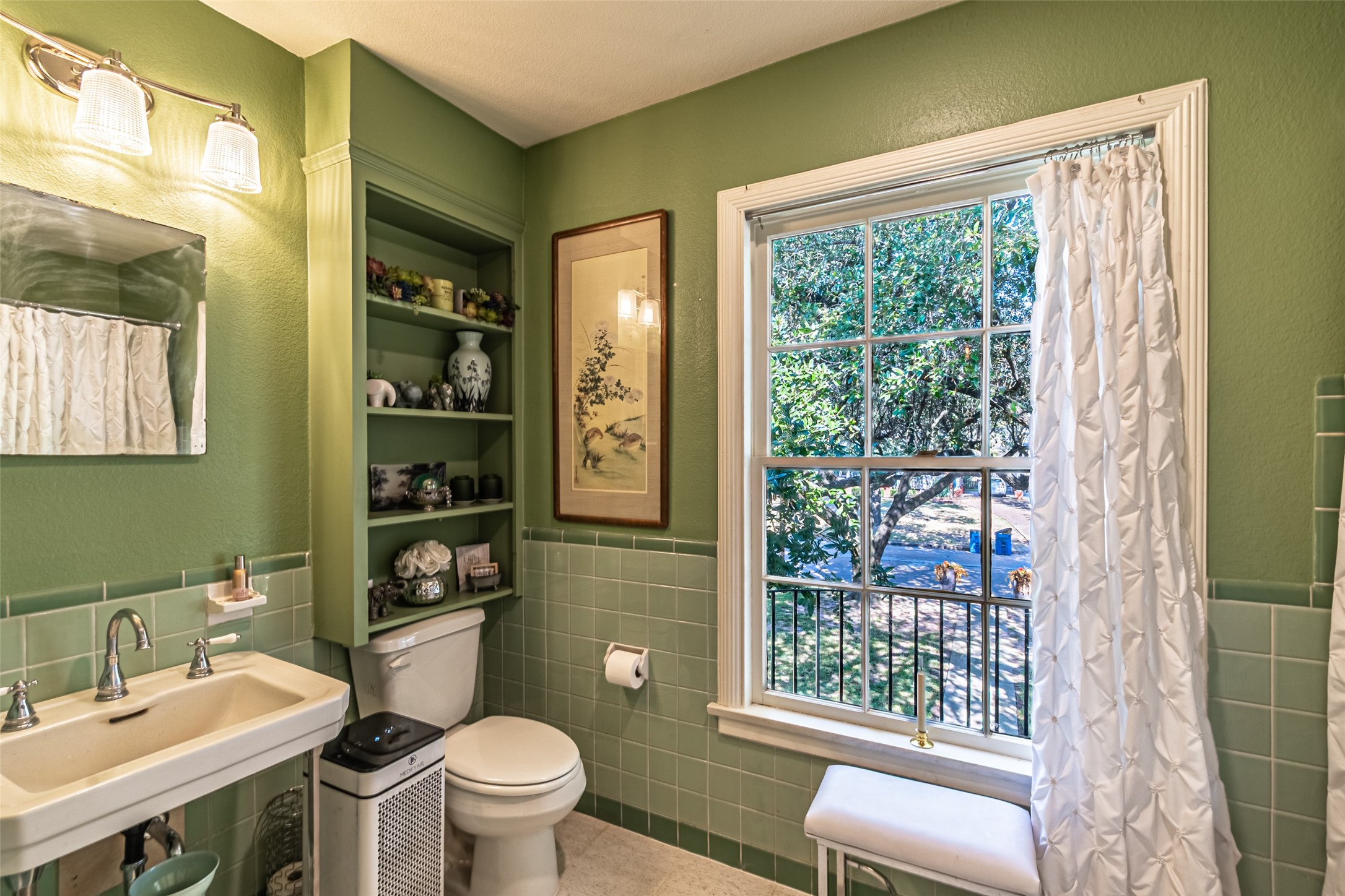706 Church Street Navasota, TX 77868 - Photo 24 of 50 a bathroom with a toilet a sink and a large mirror