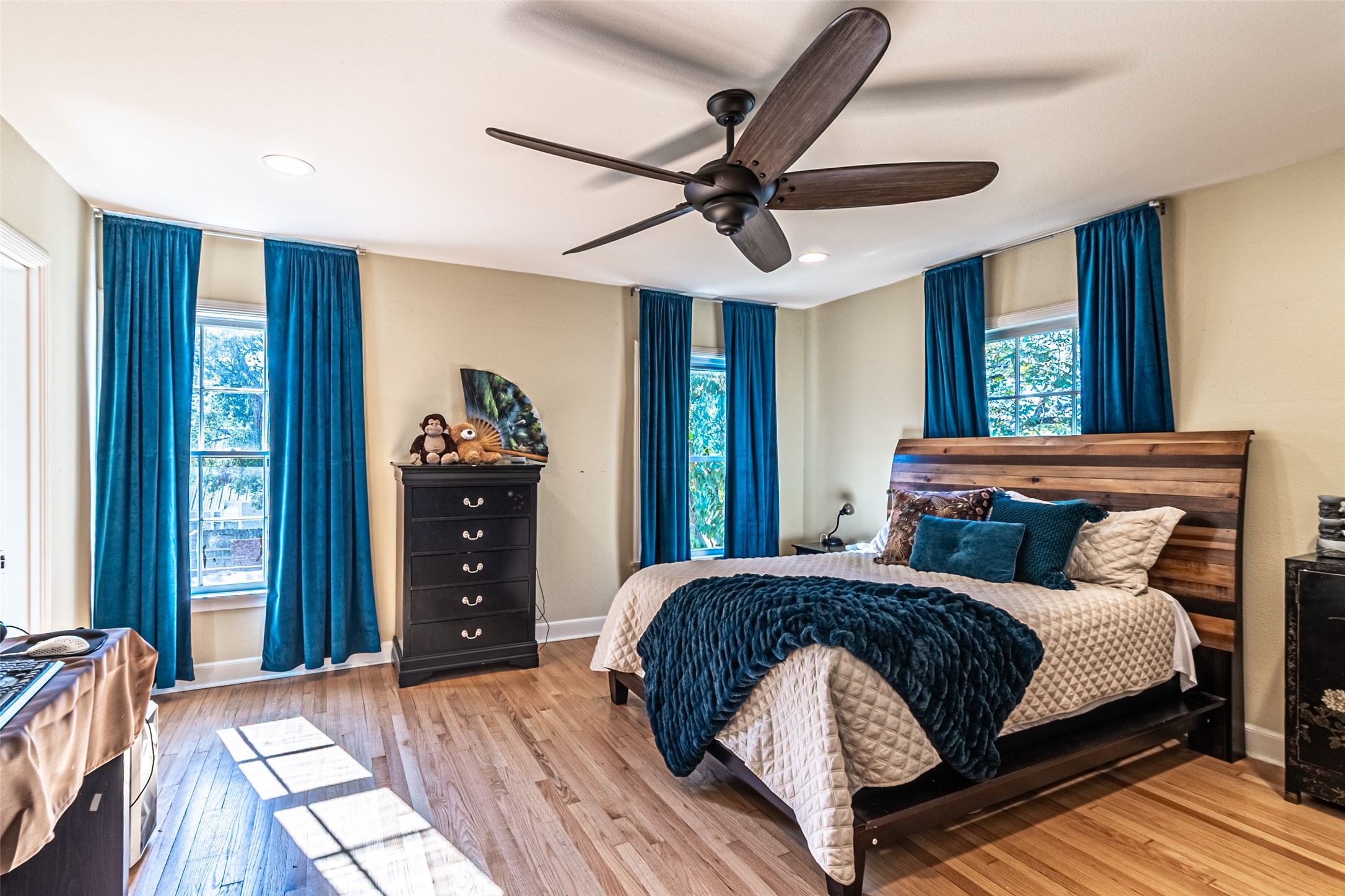 706 Church Street Navasota, TX 77868 - Photo 28 of 50 a bedroom with a bed and a chandelier