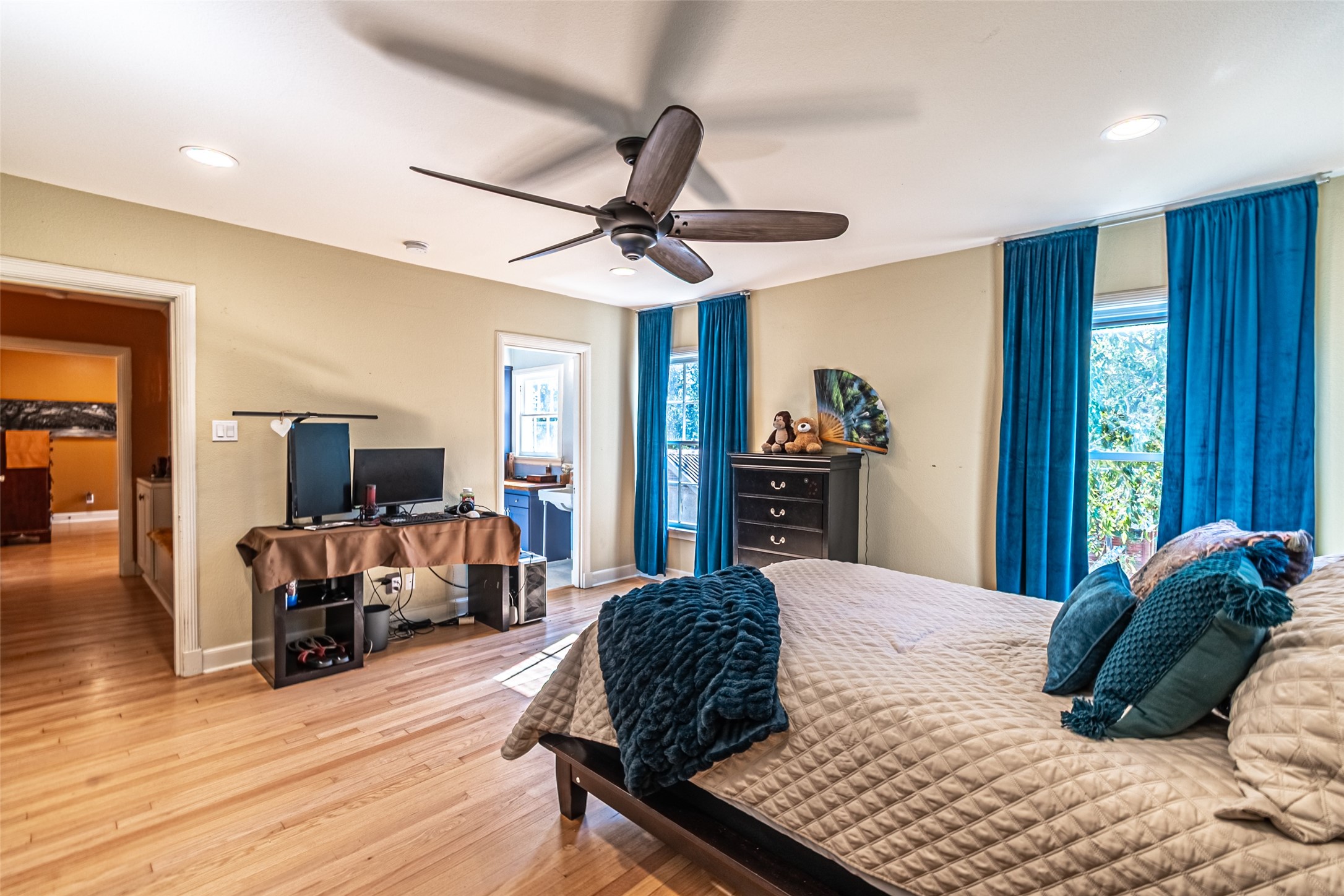 706 Church Street Navasota, TX 77868 - Photo 29 of 50 a bedroom with a bed and wooden floor