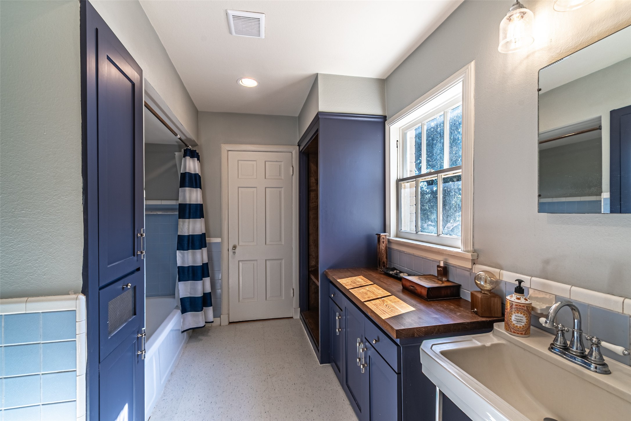 706 Church Street Navasota, TX 77868 - Photo 30 of 50 a bathroom with a sink and a mirror