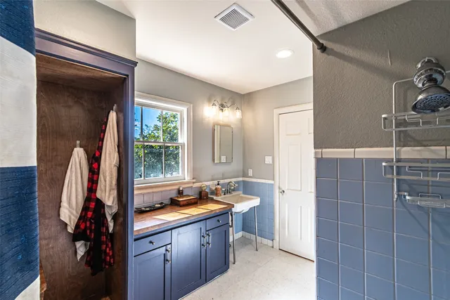 a view of room with cabinet and stairs