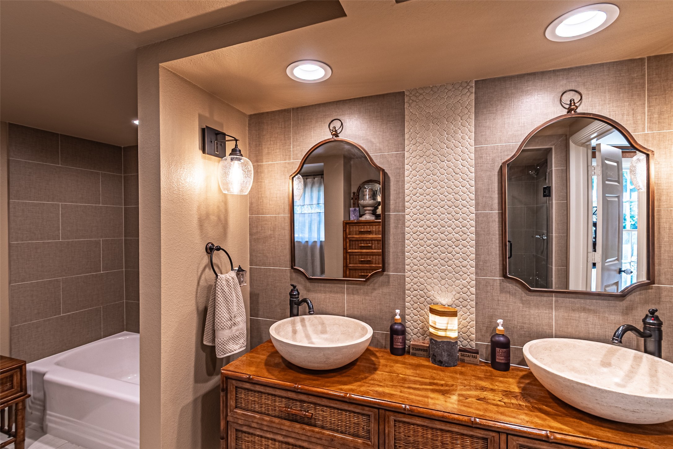 706 Church Street Navasota, TX 77868 - Photo 35 of 50 a bathroom with a double vanity sink and a mirror
