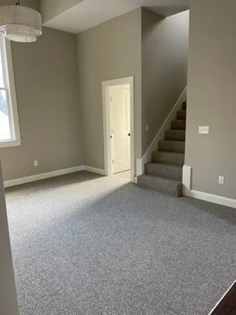 a room with a door and wooden floor