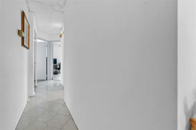 a bathroom with a sink a toilet and shower curtain