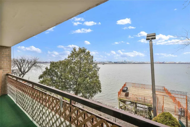 a view of a balcony with wooden floor