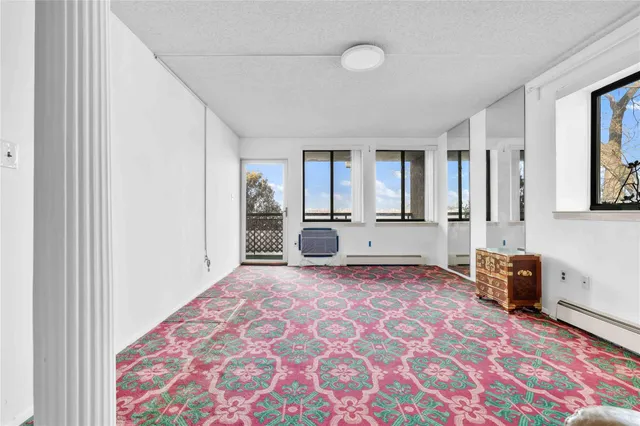 a view of a livingroom with a dinning table and chair