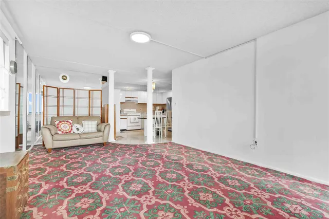 a bedroom with a bed and a lamp