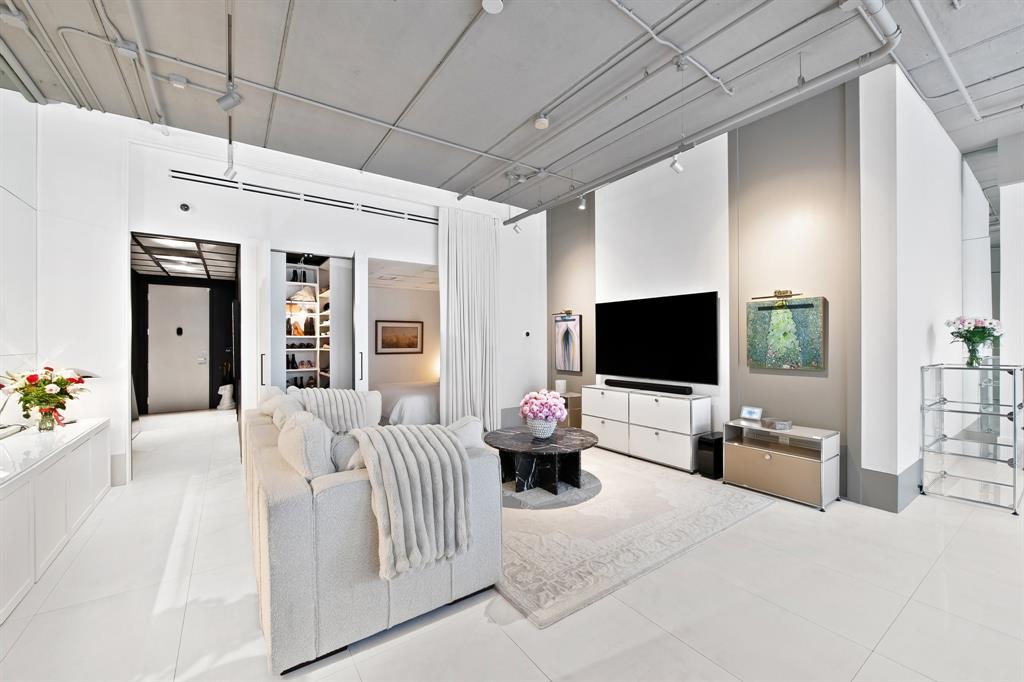 425 North Andrews Avenue, Unit 206 Fort Lauderdale, FL 33301 - Photo 11 of 17 a bedroom with furniture and a flat screen tv