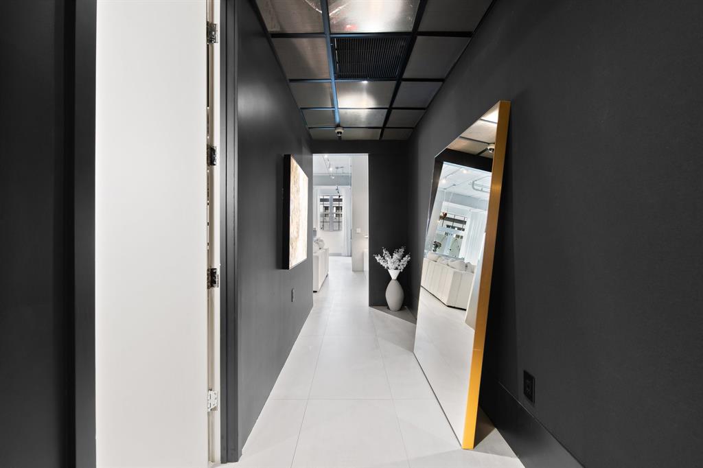 425 North Andrews Avenue, Unit 206 Fort Lauderdale, FL 33301 - Photo 13 of 17 a view of a hallway with wooden floor and staircase