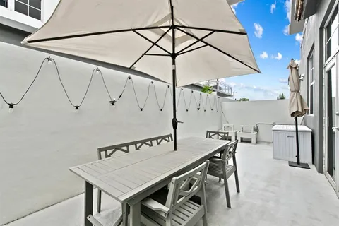 a view of table and chairs in the patio