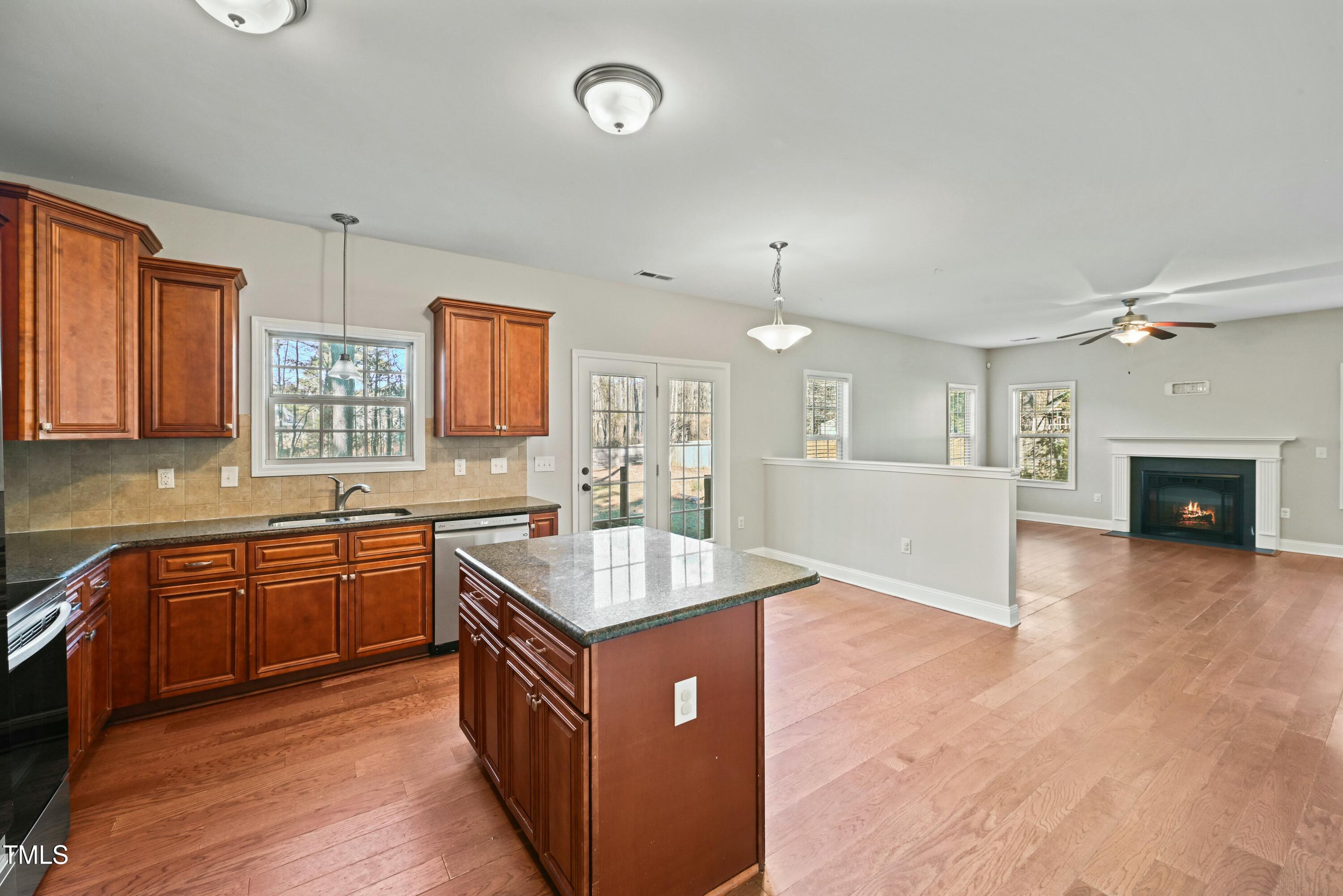 64 Valor Circle Bunnlevel, NC 28323 - Photo 11 of 34 a kitchen with sink cabinets and wooden floor