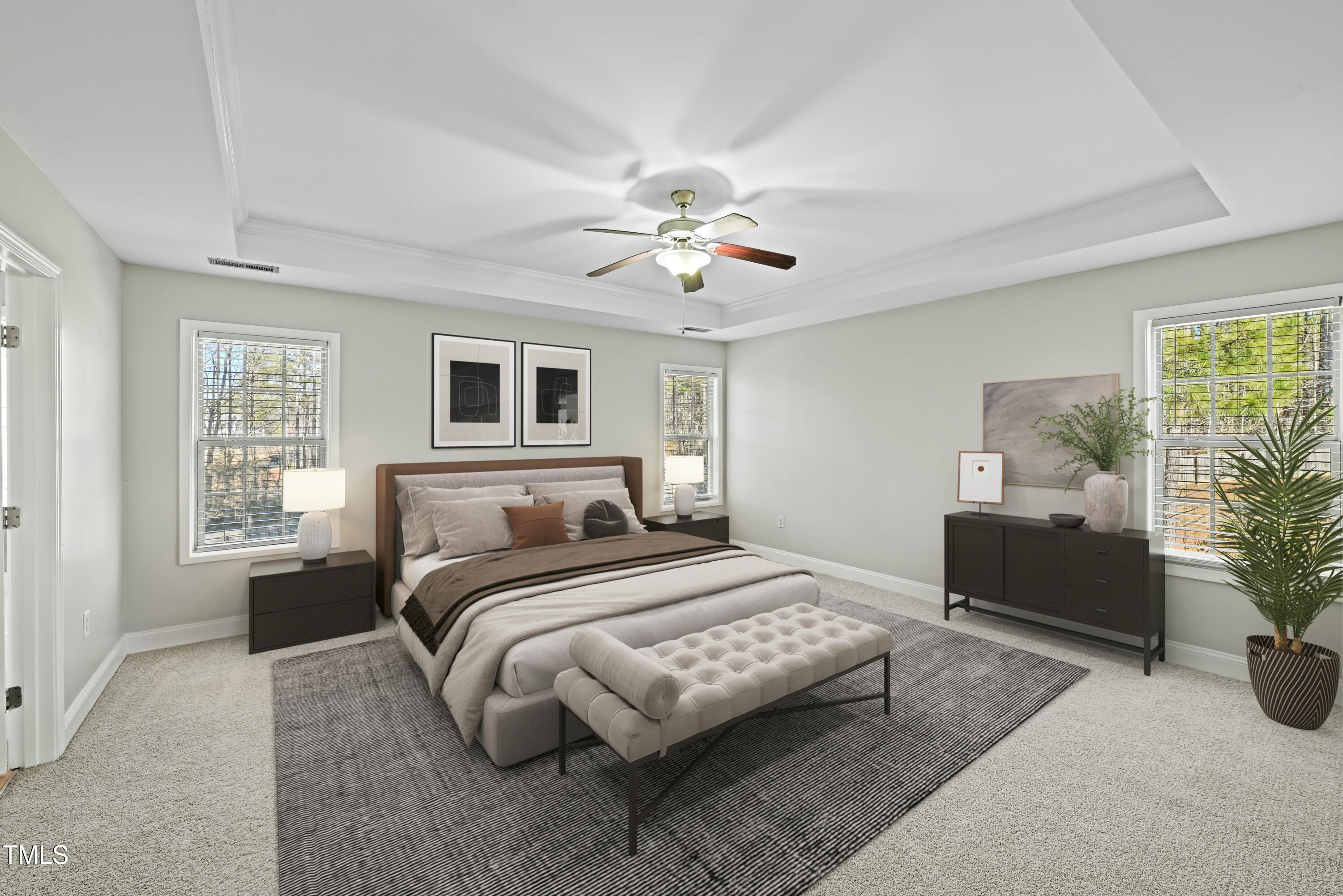 64 Valor Circle Bunnlevel, NC 28323 - Photo 16 of 34 a bedroom with a large bed and a chandelier fan