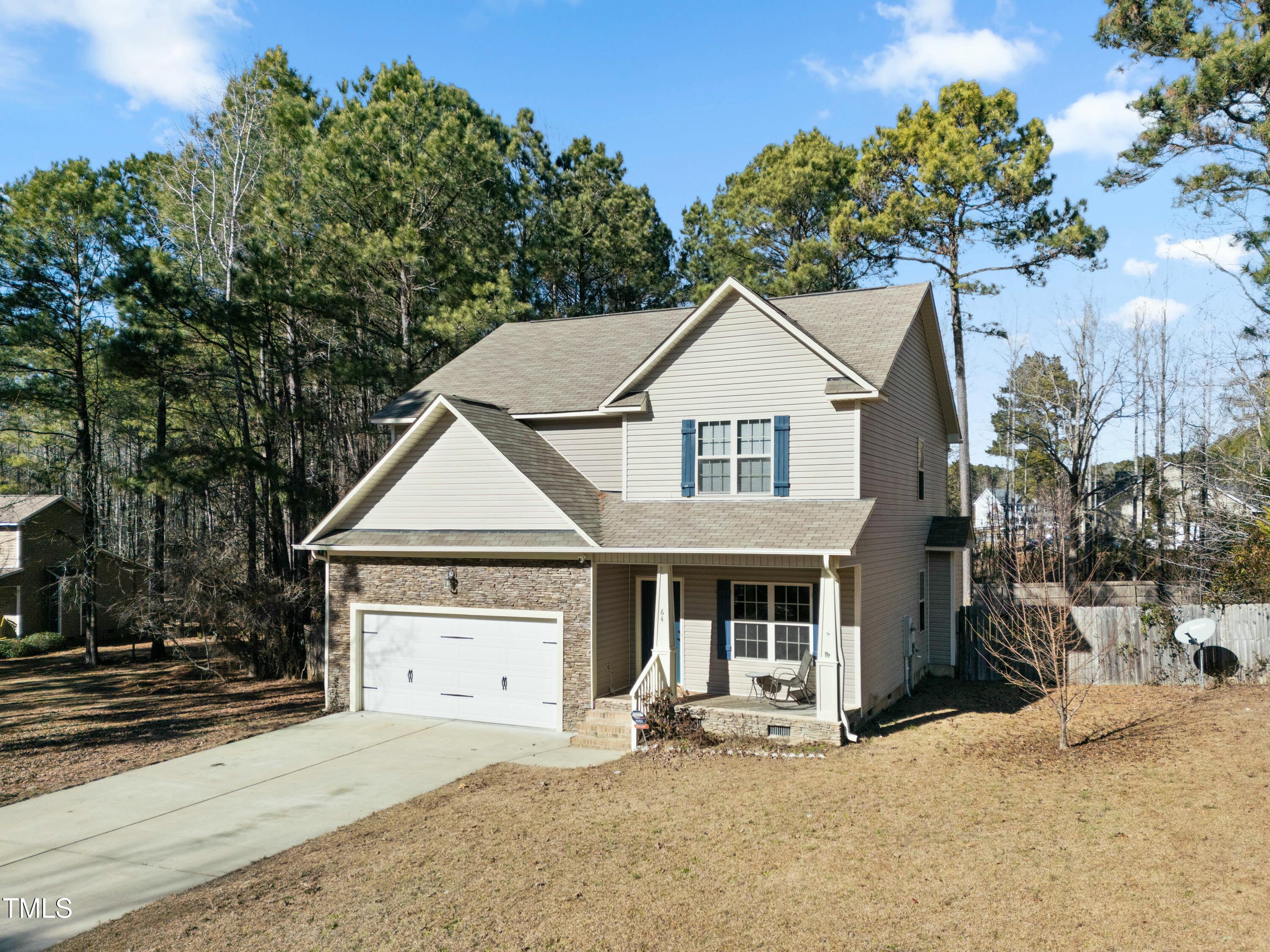 64 Valor Circle Bunnlevel, NC 28323 - Photo 2 of 34 a front view of a house with garden