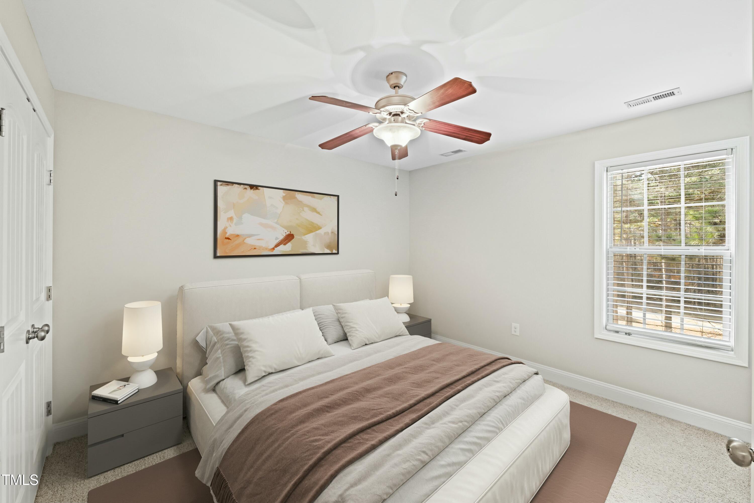 64 Valor Circle Bunnlevel, NC 28323 - Photo 22 of 34 a bedroom with a large bed and a window