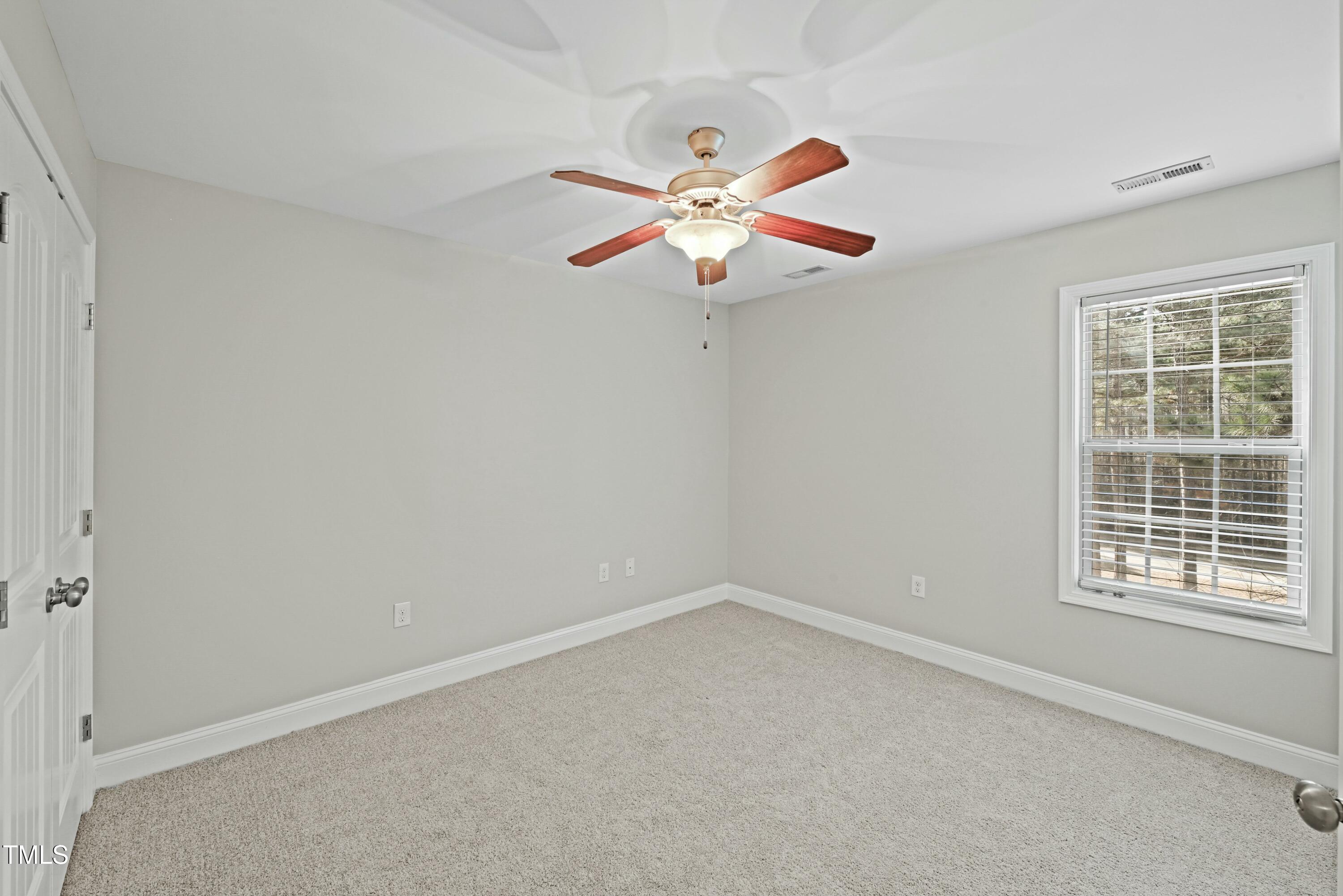 64 Valor Circle Bunnlevel, NC 28323 - Photo 23 of 34 a view of an empty room with a window