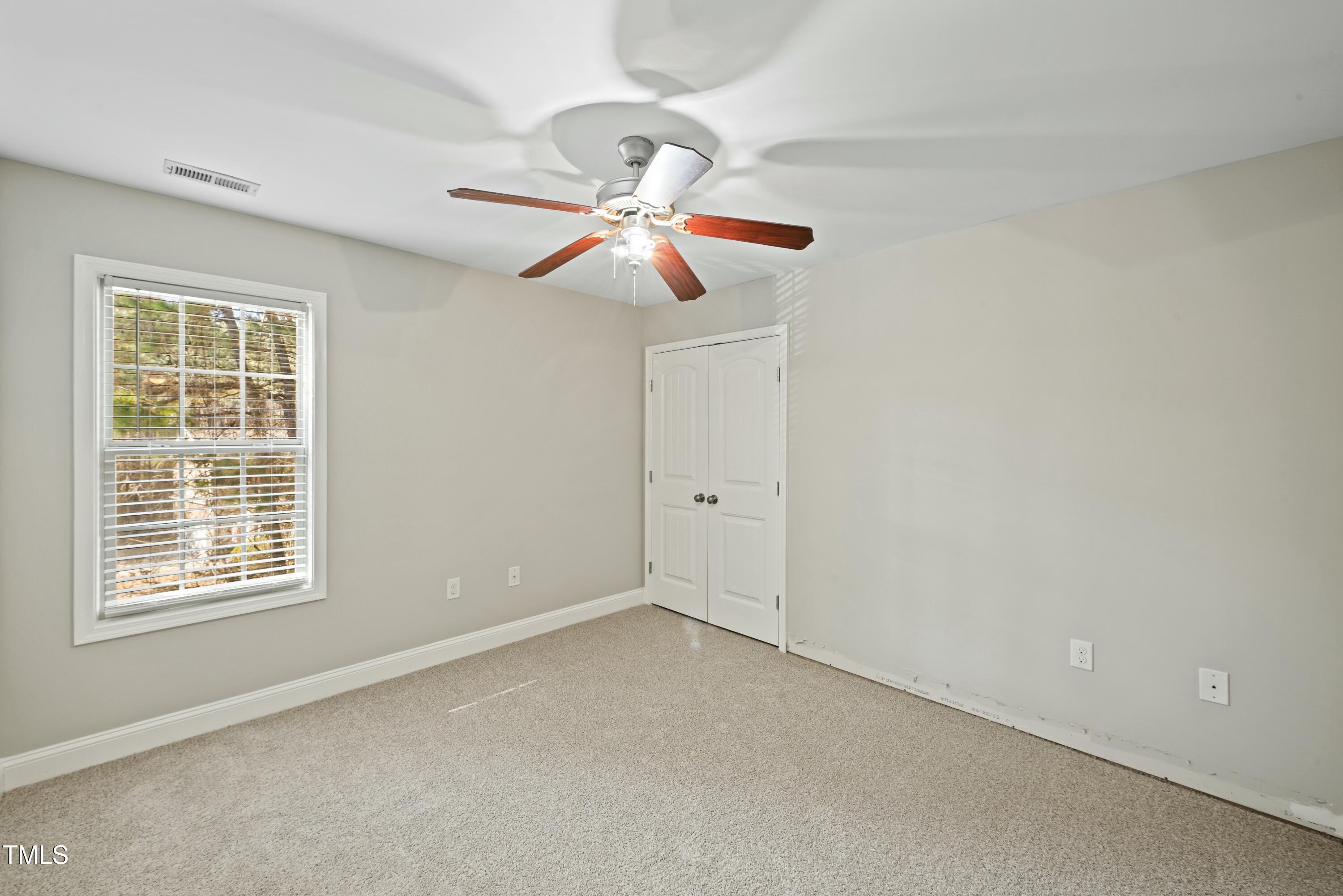 64 Valor Circle Bunnlevel, NC 28323 - Photo 25 of 34 a view of an empty room with a window