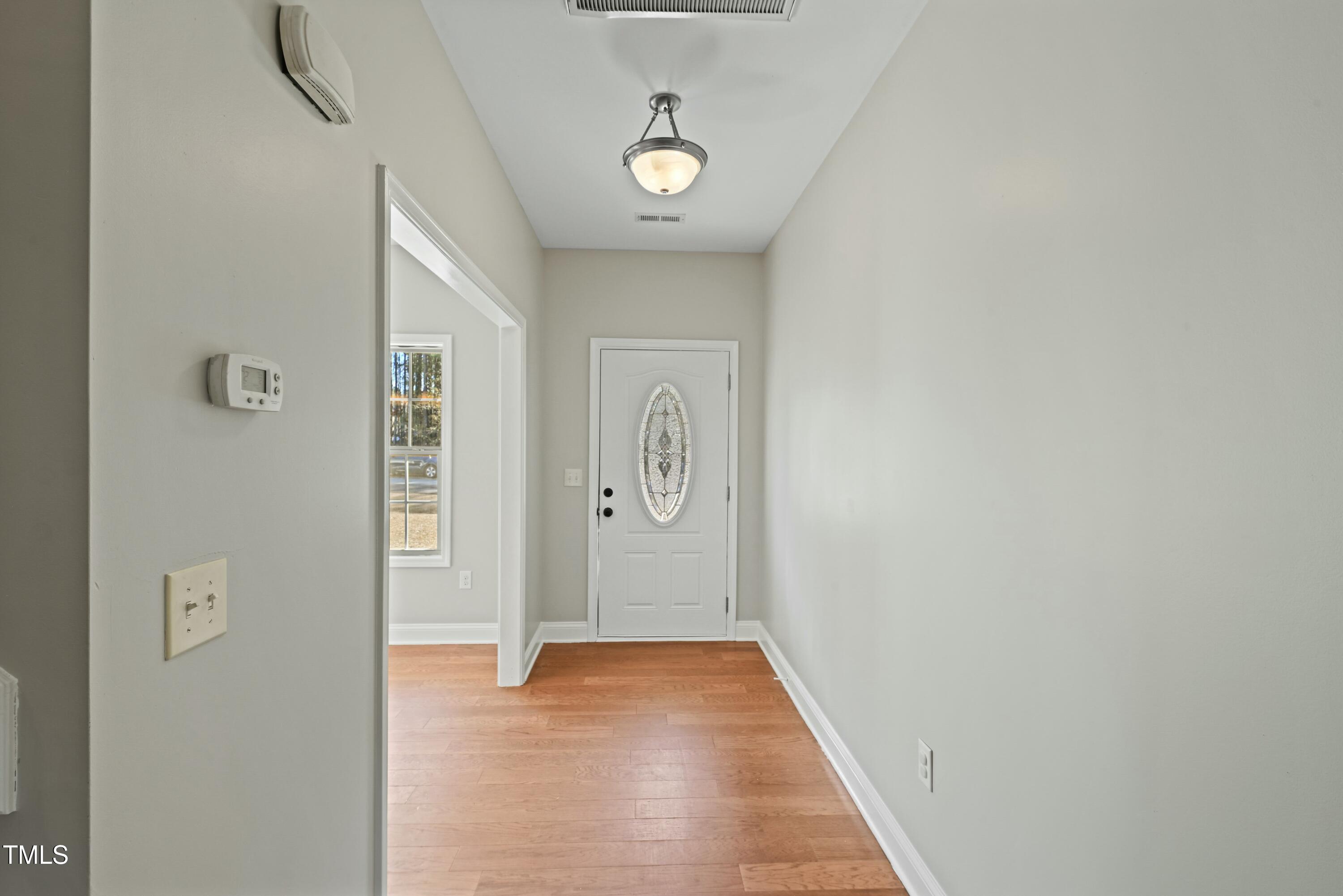64 Valor Circle Bunnlevel, NC 28323 - Photo 3 of 34 a view of a livingroom with wooden floor and a window