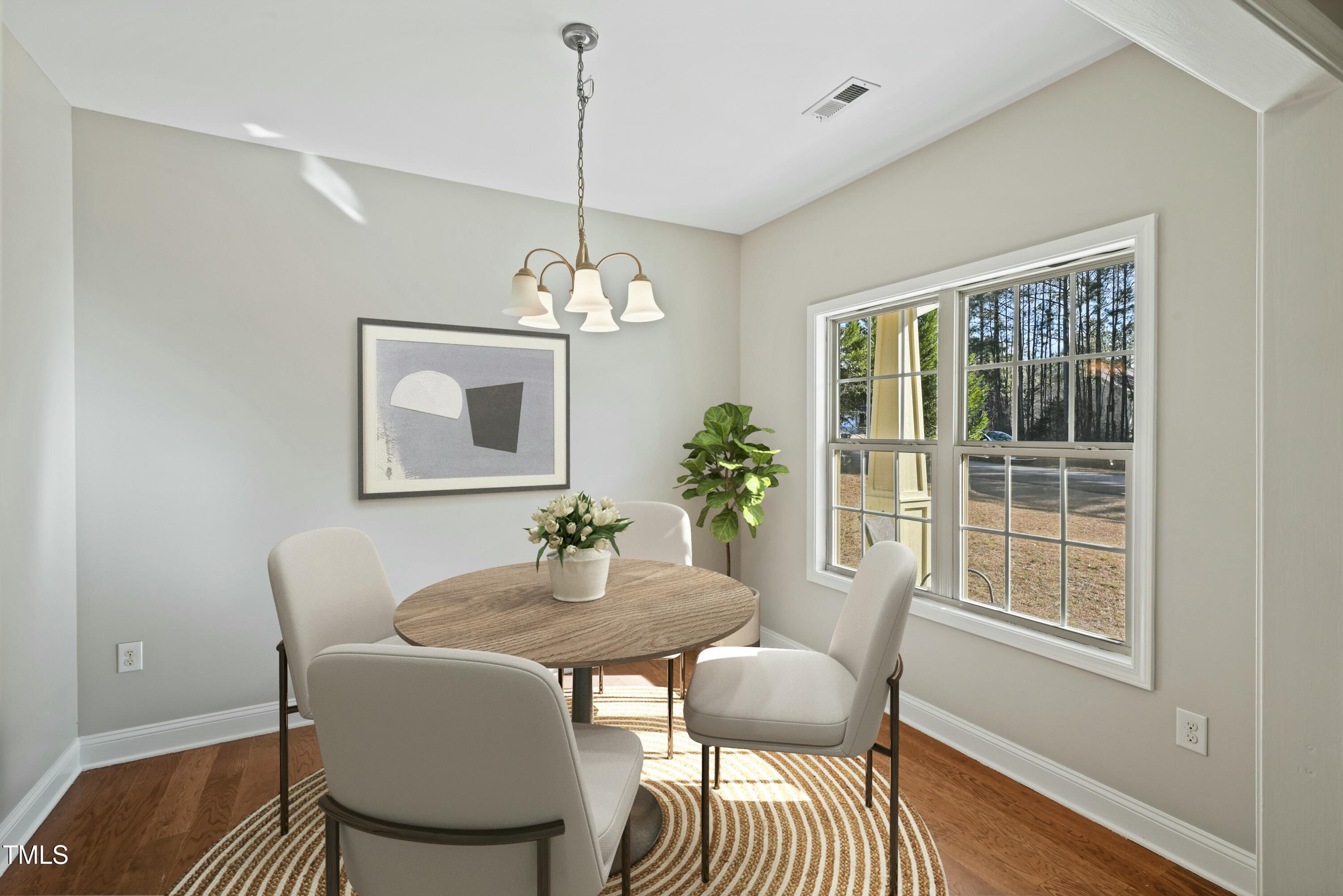 64 Valor Circle Bunnlevel, NC 28323 - Photo 4 of 34 a view of a dining room with furniture window and wooden floor