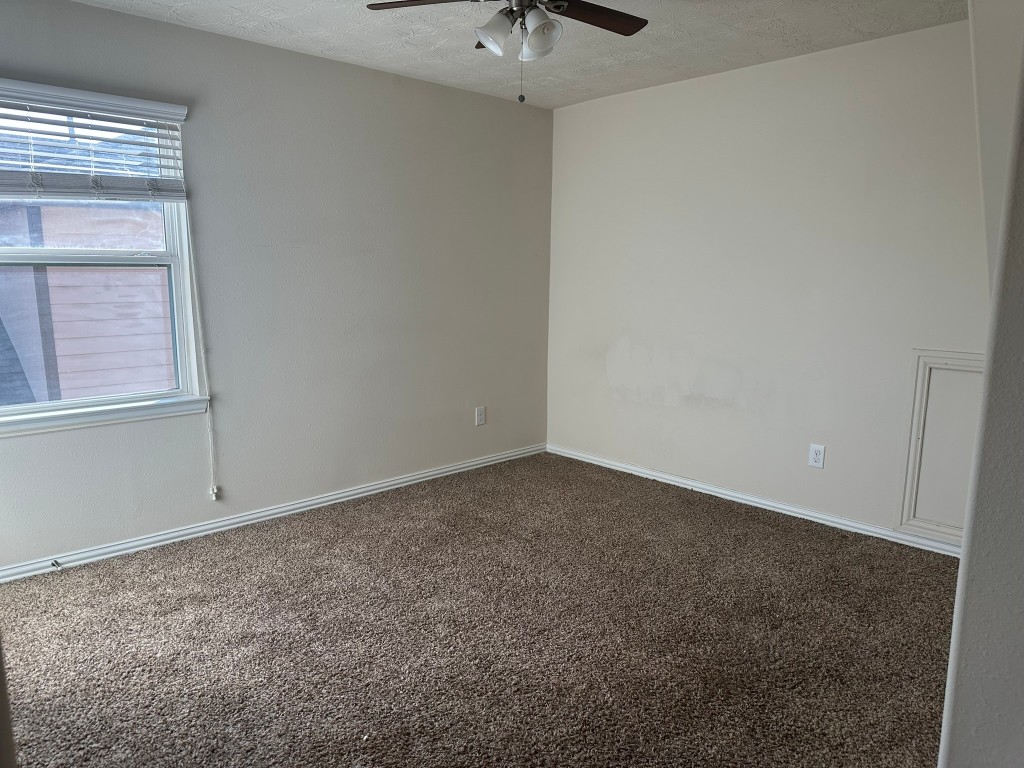 9914 Channel Set Way Rosharon, TX 77583 - Photo 16 of 24 a view of an empty room with a window