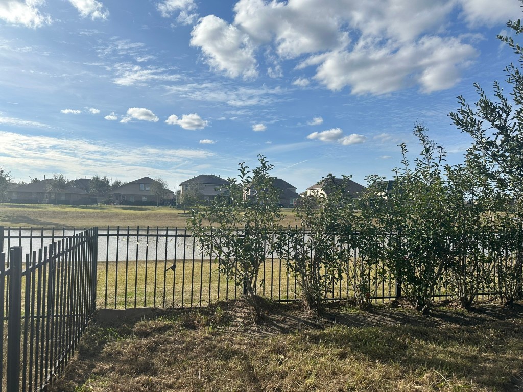9914 Channel Set Way Rosharon, TX 77583 - Photo 20 of 24 a view of a lake from a yard