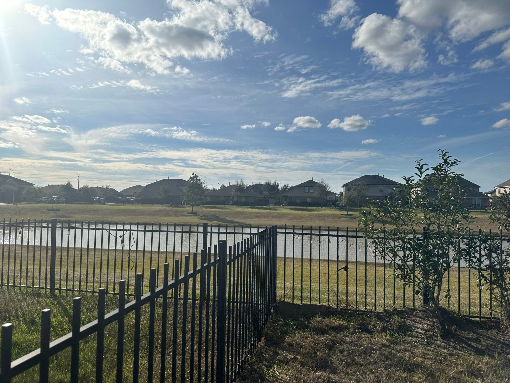9914 Channel Set Way Rosharon, TX 77583 - Photo 21 of 24 a view of a roof deck with wooden fence